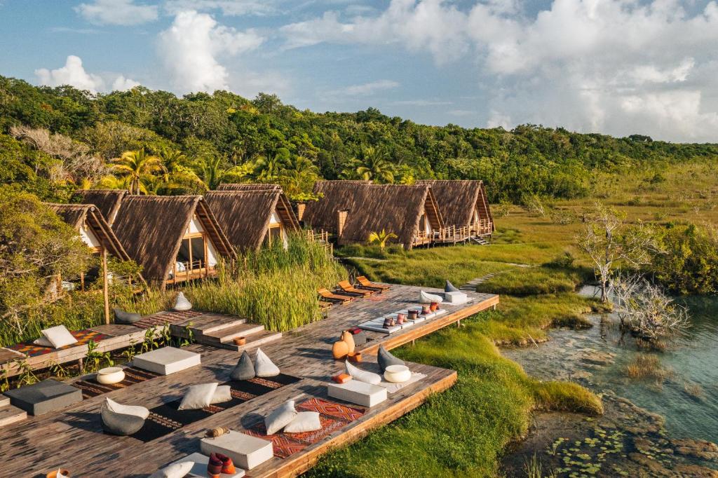 Habitas Bacalar opposite the lagoon, surrounded by mangroves and jungle  