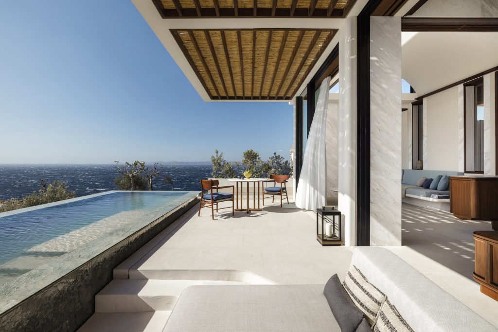 Living room opening onto terrace with swimming pool