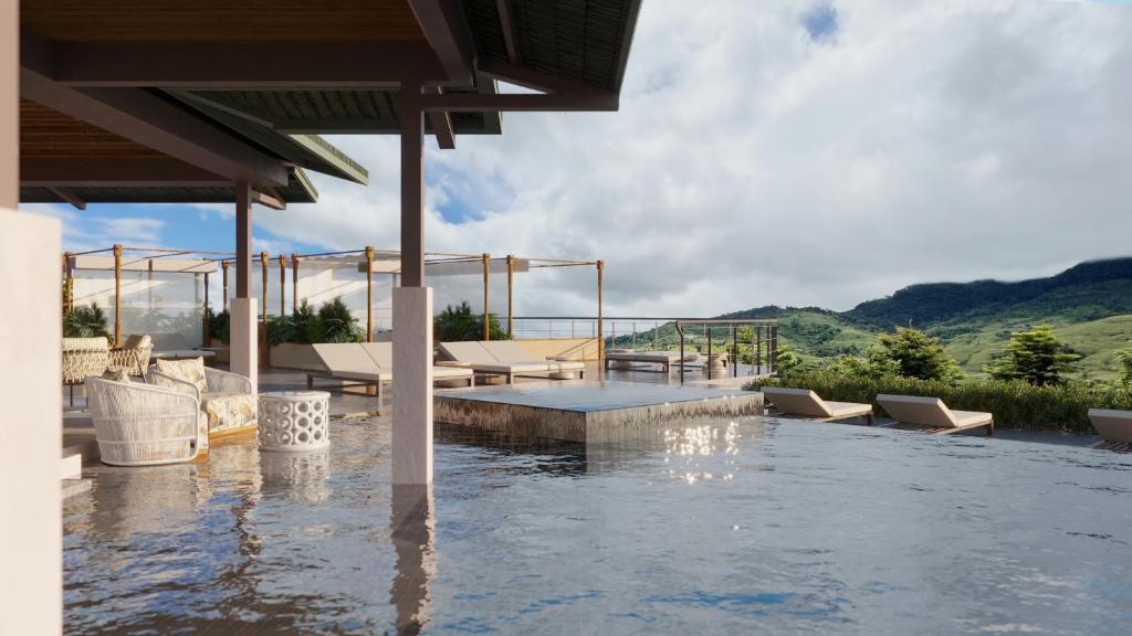Terraza con piscina infinita EL POZO AltaGracia